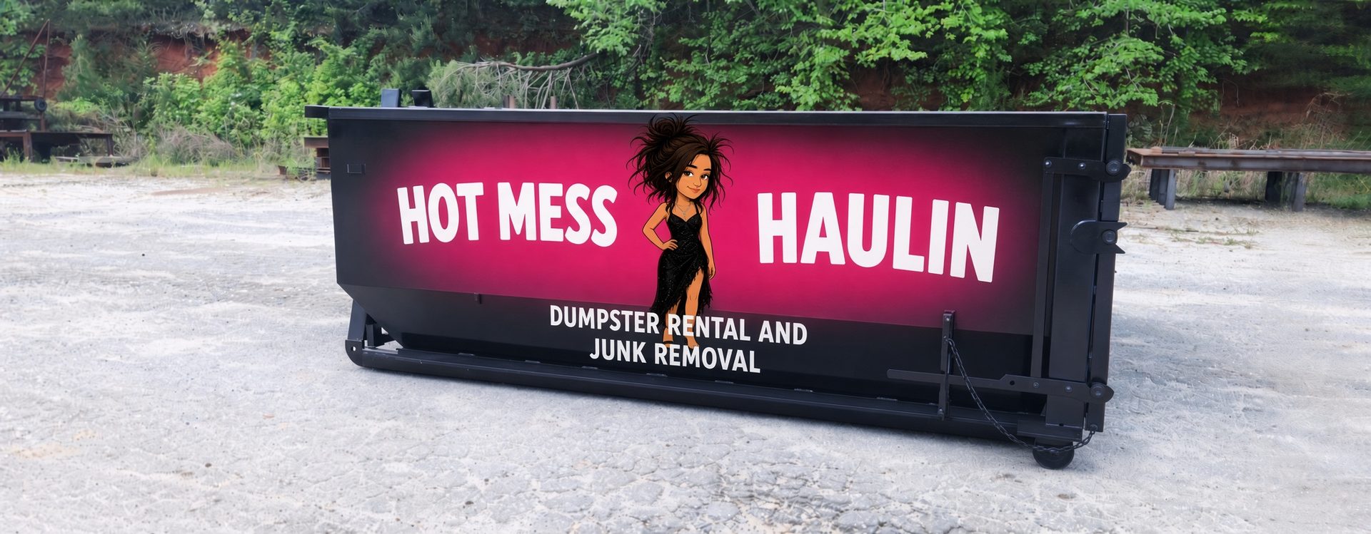 Black roll-off dumpster wrapped in the hot pink Hot Mess Haulin dumpster rental and junk removal graphic