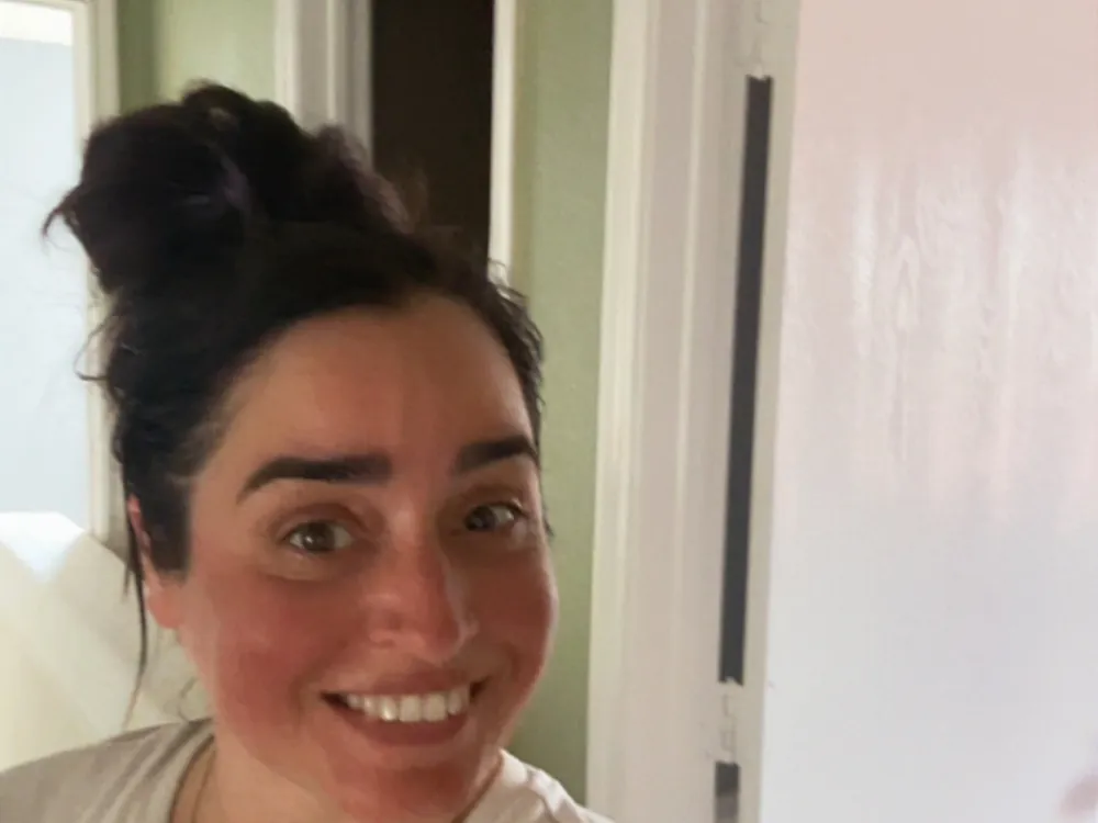 Smiling Hot Mess Haulin team member on a cleanout job